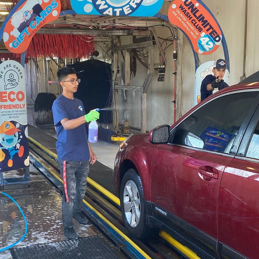 A car wash attendant hand washes a car in order to provide a thorough and personalized cleaning service for the customer. By using their hands, the attendant can reach all areas of the car's exterior, including small crevices and hard-to-reach spots. They may also use specialized cleaning products and tools to remove tough stains or dirt buildup.