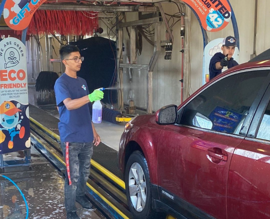 A car wash attendant hand washes a car in order to provide a thorough and personalized cleaning service for the customer. By using their hands, the attendant can reach all areas of the car's exterior, including small crevices and hard-to-reach spots. They may also use specialized cleaning products and tools to remove tough stains or dirt buildup.
